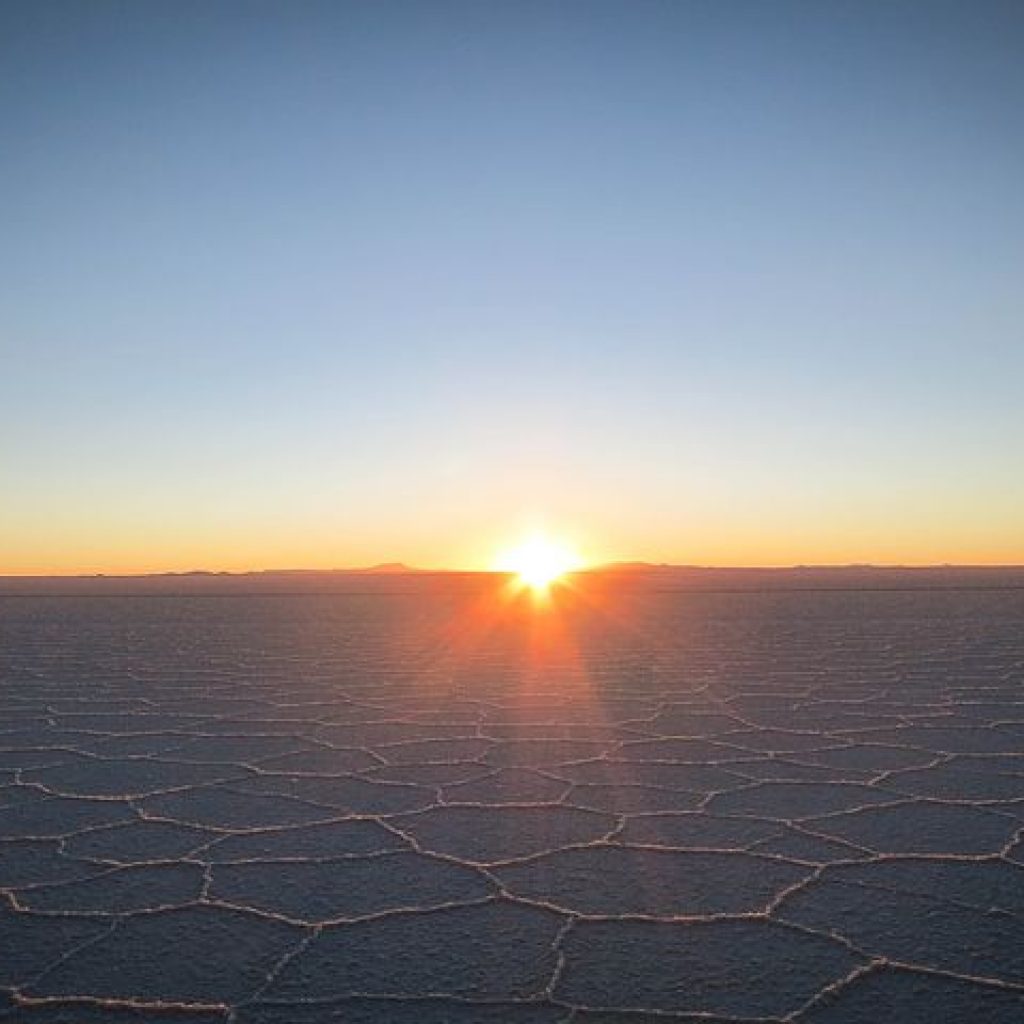 Picture of the Uyuni Salt Flats with the sunset in the background. Photo from Pixabay
